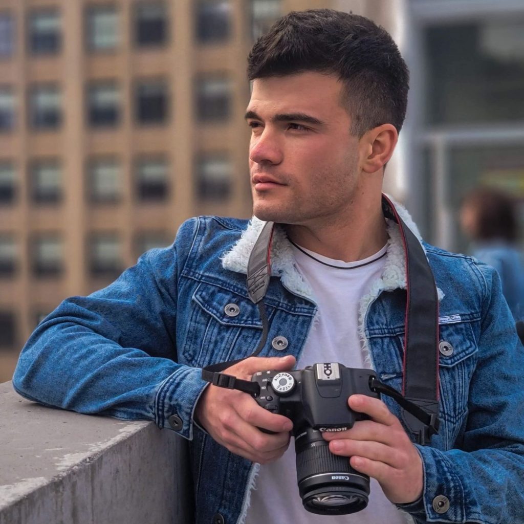 man holding a professional camera